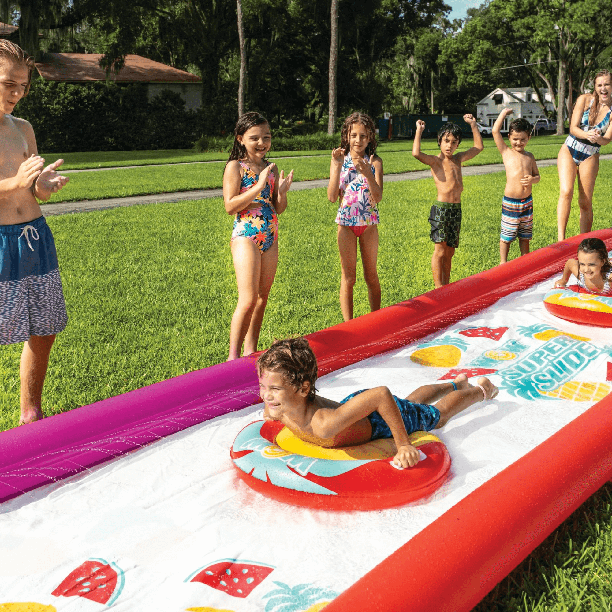 WOW Watersports Giant Backyard Double Lane Lawn Slide, Heavy Duty PVC and 2 Inflatable Sleds Jupiter Gear Home